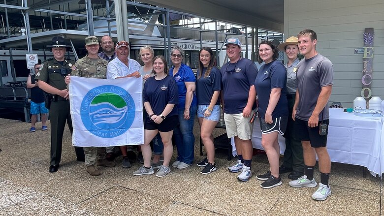 The Dale Hollow State Park Marina earned the Clean Marina Award at Dale Hollow State Park Marina in Burkesville, Kentucky on Aug. 6, 2022. Kentucky Department of Fish and Wildlife Resources Sgt. Bryan Dolen (left) Nashville District Commander Lt. Col. Joseph Sahl (left, front), Mid-Cumberland Area Operation Manager Terrell Stoves (left, back), and Clean Marina Coordinator and Dale Hollow Park Ranger Sondra Carmen (right, back) congratulate Dale Hollow State Park Marina General Manager Glen Stone (left, front) and the marina team for their hard work and dedication.