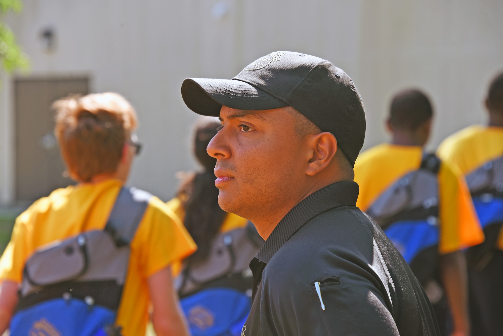 A picture of a Youth Academy instructor looking at class participants while preparing for the next demonstration.