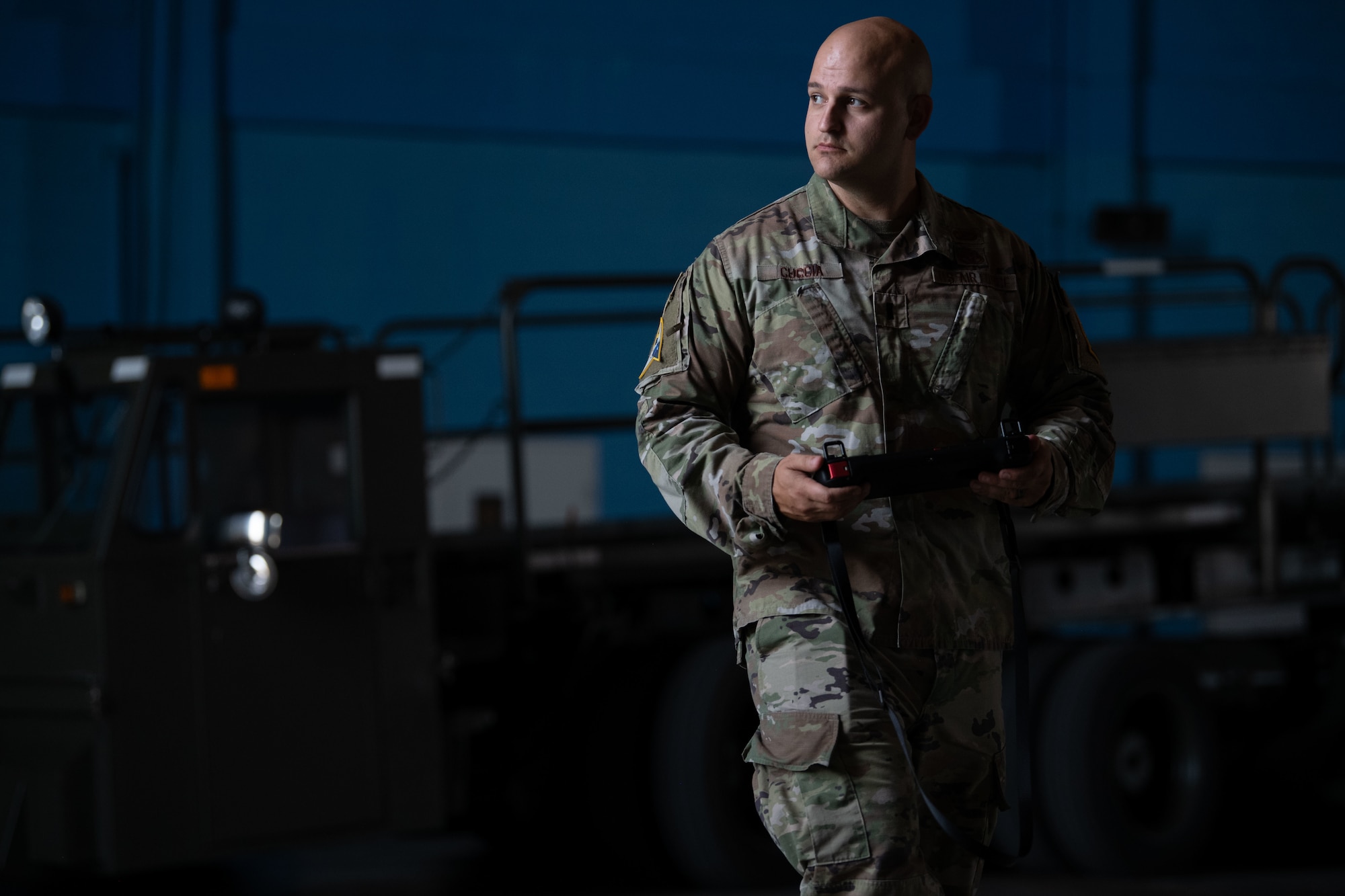 U.S. Air Force 1st Lt. Andrew Cuccia chief innovation officer, operates a Ghost Robotics, Vision 60 Quadruped Unmanned Ground Vehicle (Q-UGV) with a handheld controller at Cape Canaveral Space Force Station, Fla., July 27, 2022. The Q-UGV will be used for damage assessments and patrol to save significant man hours. (U.S. Space Force photo by Senior Airman Samuel Becker)