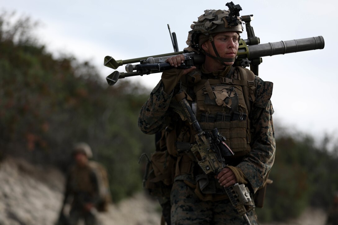 U.S. Marine Corps Pfc. Christopher Fennel, a mortarman with Weapons Company, 3rd Battalion, 1st Marine Regiment, 1st Marine Division, carries an M224 60 mm mortar system to a range during a Tactical Small Unit Leaders Course at Marine Corps Base Camp Pendleton, California, Jan. 31, 2022. Marines with 3/1 participated in TSULC in order to give small unit leaders the confidence, knowledge and ability to better lead their Marines in combat situations.