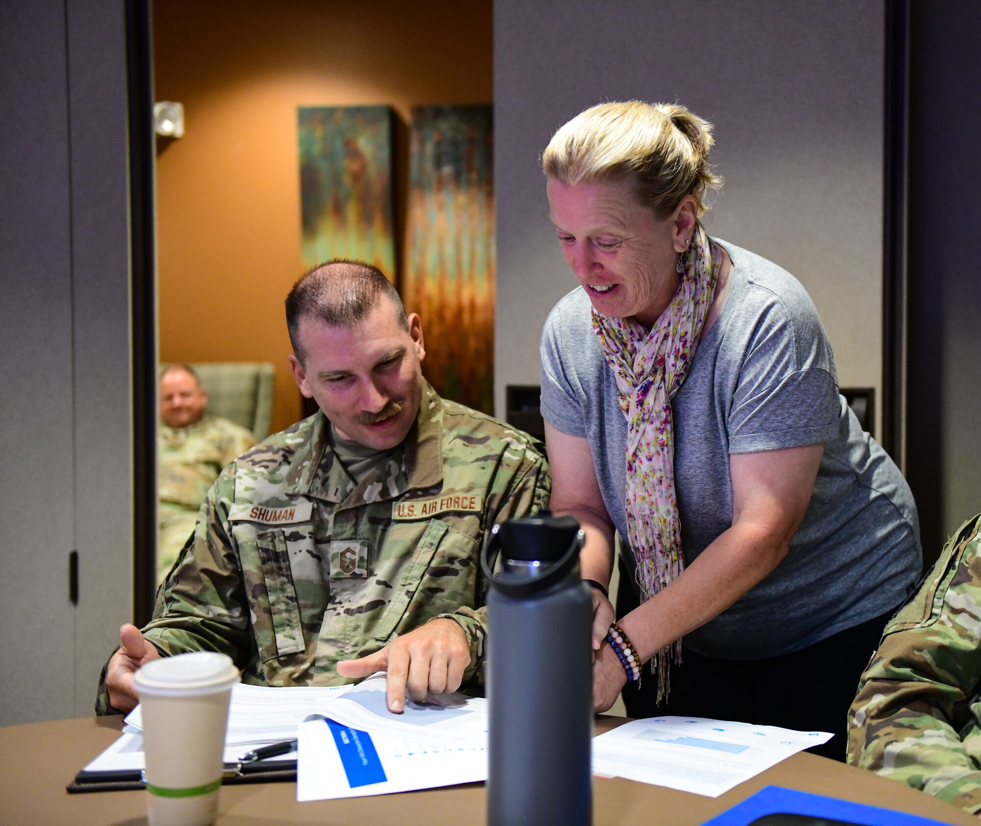 Senior Master Sgt. Jared Shuman, an executive officer assigned to the 910th Communications Squadron, and Karen Hazle-Johnson, 910th Airlift Wing violence prevention integrator, discuss managing fragile moments during a senior non-commissioned officer enlisted symposium, Aug. 9, 2022, at Youngstown Air Reserve Station, Ohio.