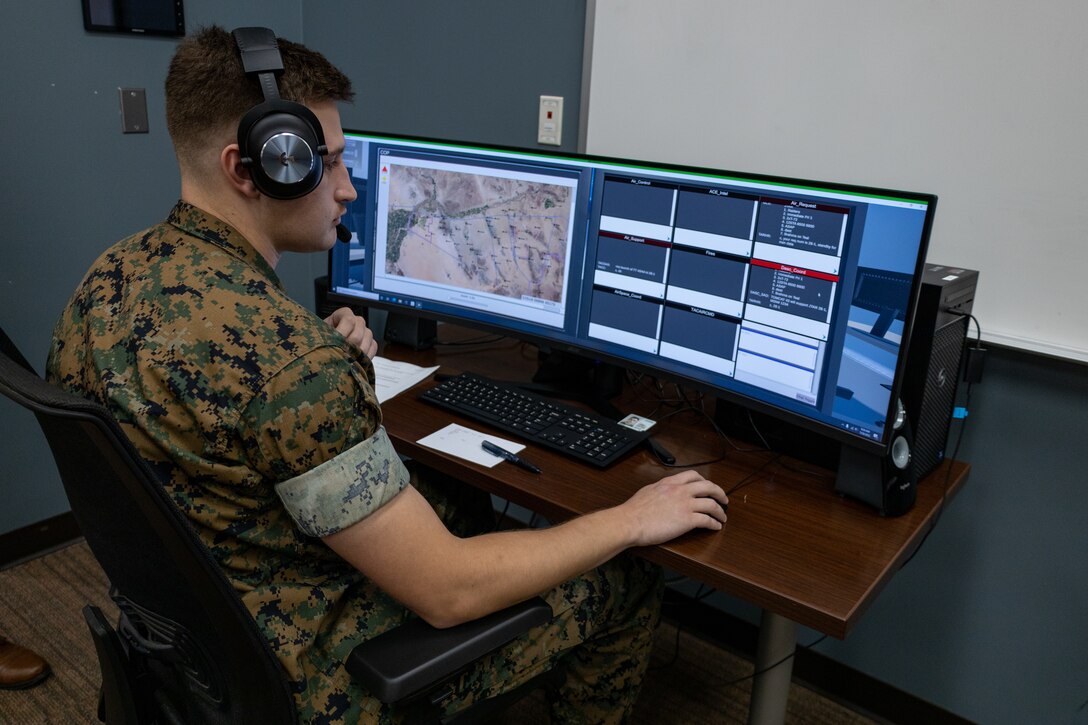 U.S. Marine Corps 2nd Lt. Joseph B. Greer, an air-support control officer with Marine Air Support Squadron (MASS) 1, operates a prototype of the Gaming Environment for Air Readiness at Marine Corps Air Station Cherry Point, North Carolina, July 28, 2022. The GEAR is an artificial-intelligence enabled and role-based simulation designed to train and develop MASS-1 Marines by exposing them to interactive scenarios prior to participating in an exercise or deployment. MASS-1 is a subordinate unit of 2nd Marine Aircraft Wing, the aviation combat element of II Marine Expeditionary Force. (U.S. Marine Corps photo by Lance Cpl. Elias E. Pimentel III)