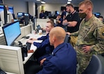 Service members form CGCYBER 2013 CPT and Army 1st IO Brigade Read Team participate in Cyber Flag 22.