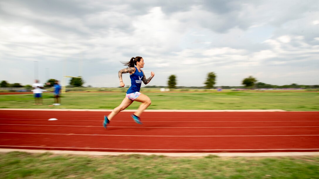 An athlete runs sprints during track practice.