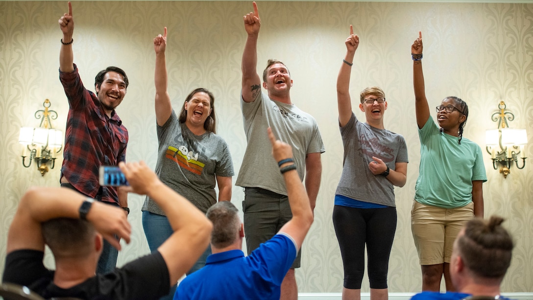 Participants play a game during an Improv class.