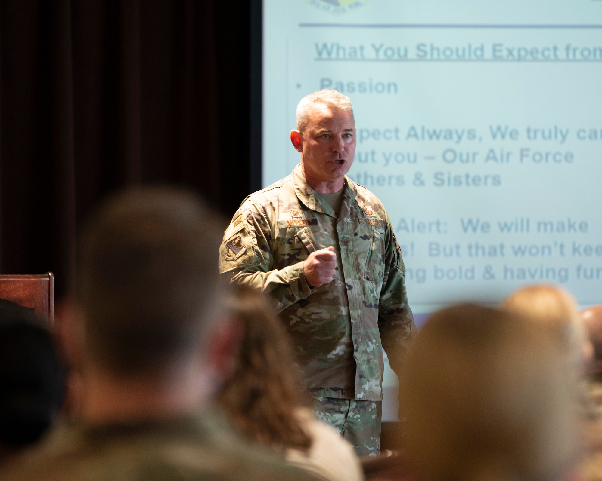 Col. Christopher Meeker, 88th Air Base Wing and installation commander, address attendees at the commander's call.