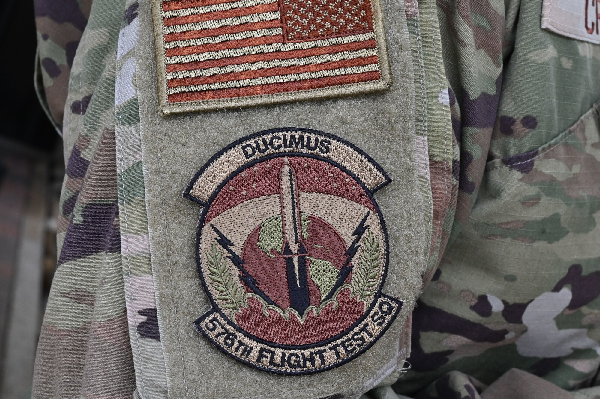 A patch is displayed on the arm of a uniform.