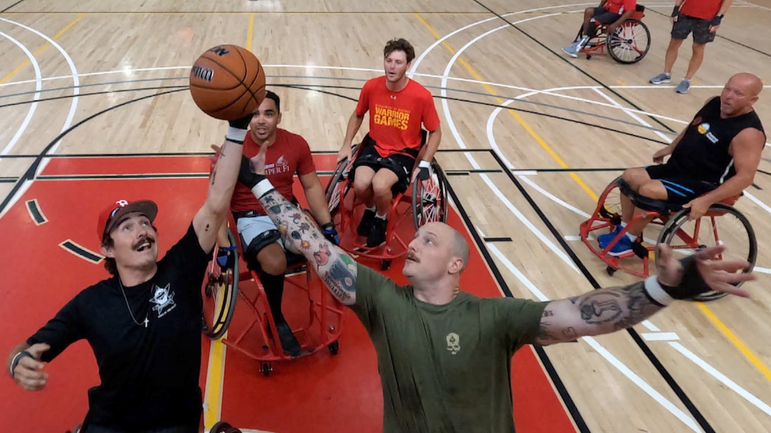 Athletes practice wheelchair basketball.