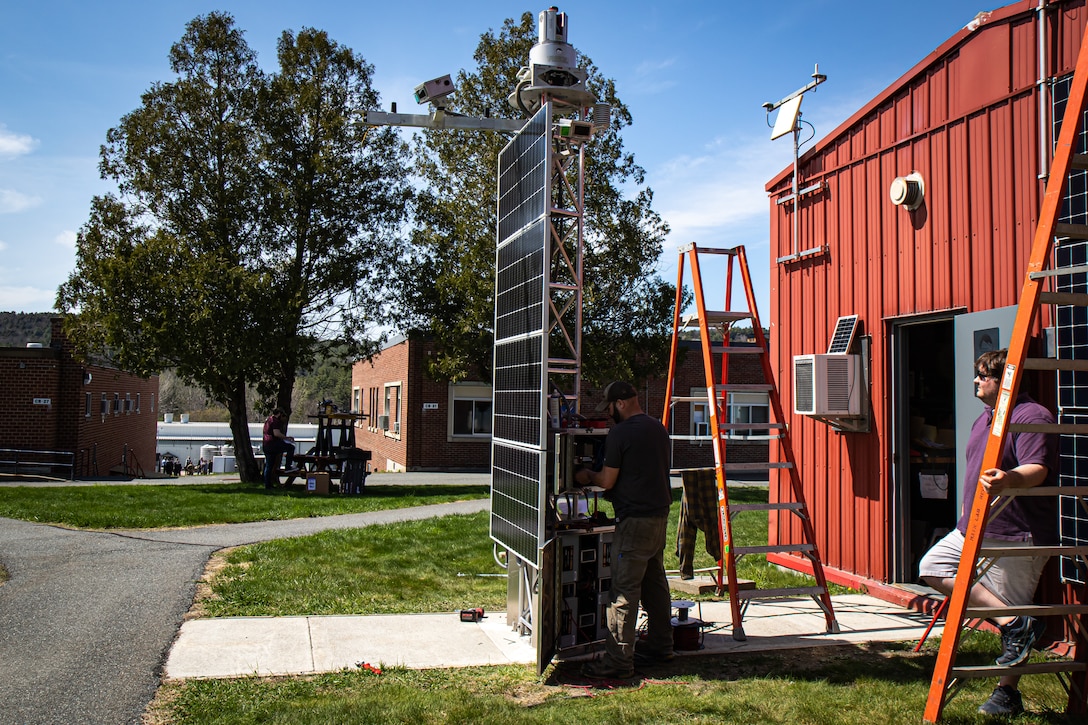 Jordan Hodge and Aaron Kehl, two mechanical engineers with the U.S. Army Engineer Research and Development Center’s Cold Regions Research and Engineering Laboratory, assemble a newly engineered automated terrestrial laser scanning system (A-TLS) on a 12-foot-tall tower affixed with multiple lidar laser scanners, meteorological sensors and solar panels to map where components go prior to the tower being disassembled and shipped to Alaska.