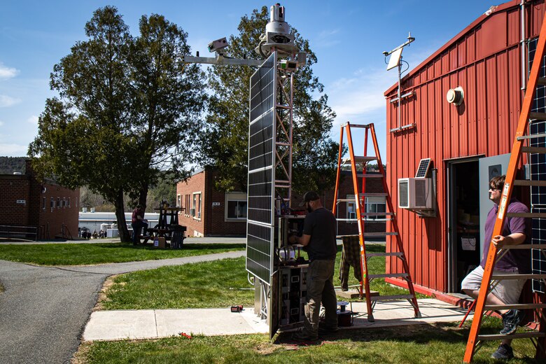 Jordan Hodge and Aaron Kehl, two mechanical engineers with the U.S. Army Engineer Research and Development Center’s Cold Regions Research and Engineering Laboratory, assemble a newly engineered automated terrestrial laser scanning system (A-TLS) on a 12-foot-tall tower affixed with multiple lidar laser scanners, meteorological sensors and solar panels to map where components go prior to the tower being disassembled and shipped to Alaska.