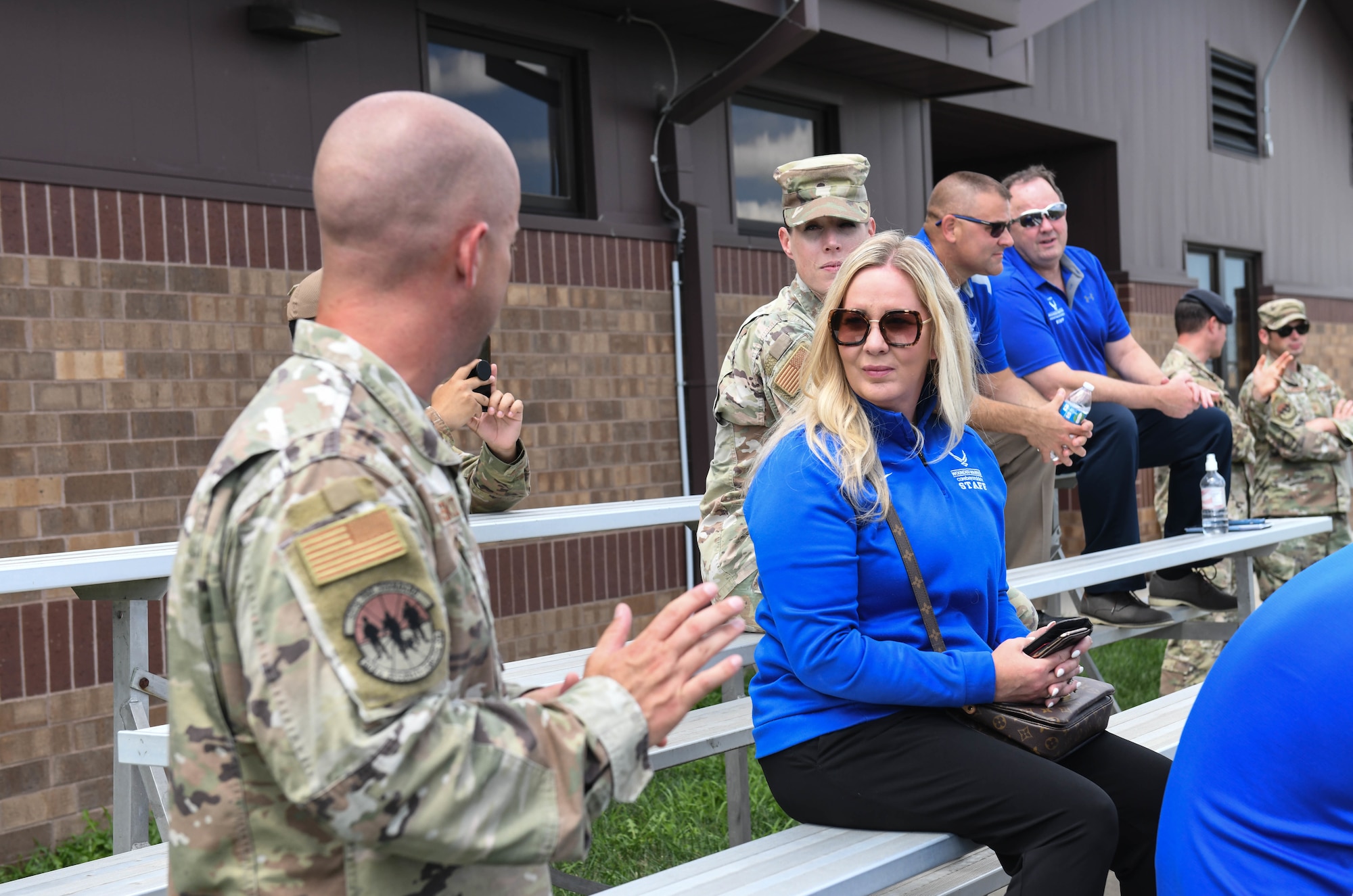 U.S. Air Force Tech. Sgt. Terry Pasko, 509th Security Forces kennel master and Melissa Wiest, Air Force Wounded Warrior program staff member, discuss the 509th Security Forces Squadron K9 Unit at Whiteman Air Force Base, Missouri, August 9, 2022. Visiting work centers around the installation assists the Air Force Wounded Warrior Project form connections with a variety of service members and increases awareness of the services they offer.