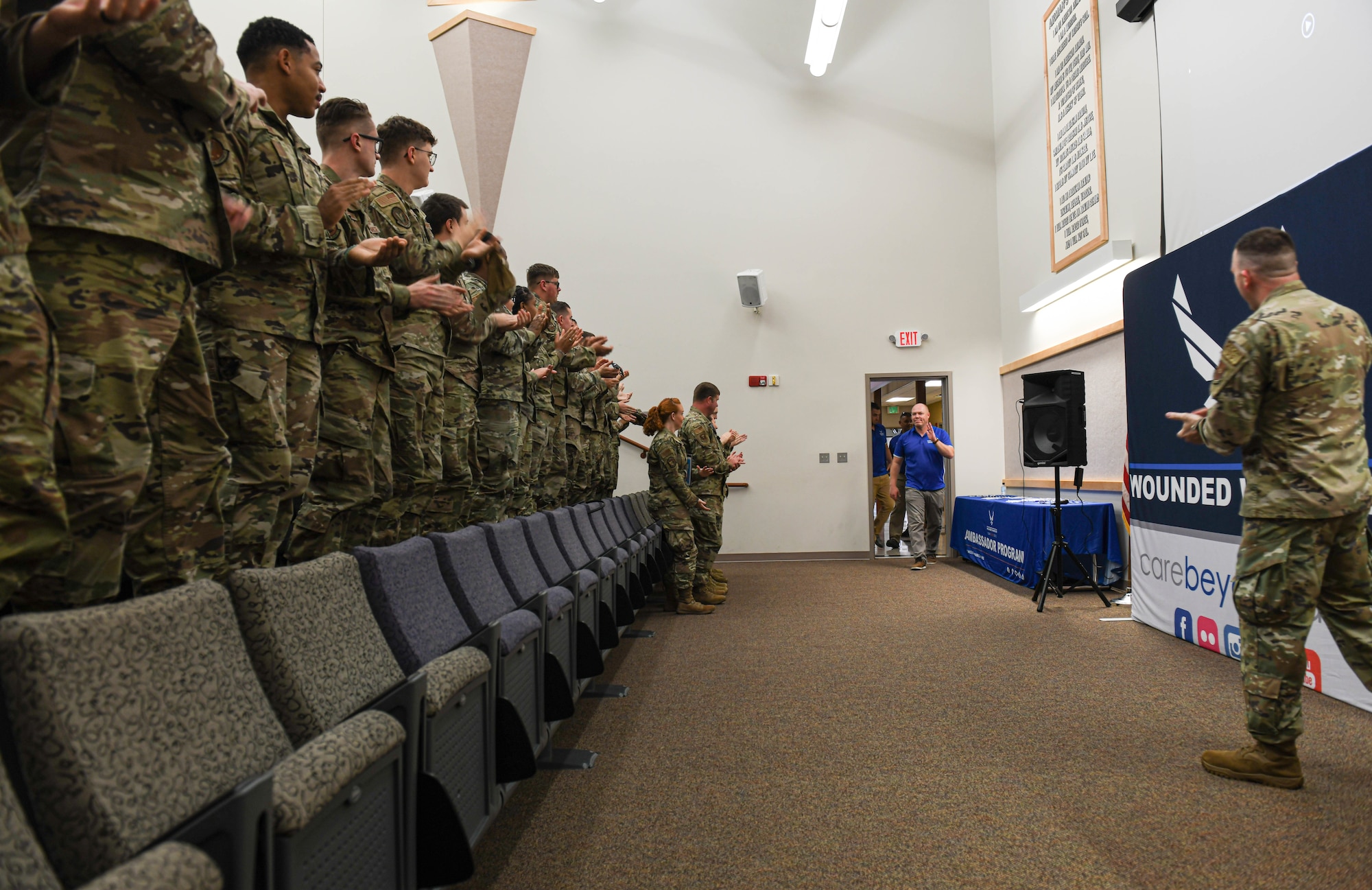 Airmen and Guardians welcome the ambassadors and staff members of the Air Force Wounded Warrior Project at Whiteman Air Force Base, Missouri, August 9, 2022. The Air Force Wounded Warrior Program ambassadors and staff speak about their program aiming to provide a refined, simplified transition back to duty or in civilian life for service members.
