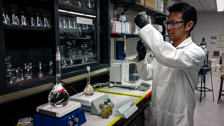 Warren Kadoya, a research physical scientist with the U.S. Army Engineer Research and Development Center’s Cold Regions Research and Engineering Laboratory, takes a sample of an anaerobic incubation of insensitive munitions compounds and sludge from a wastewater treatment plant to test for biological transformation at the University of Arizona’s Department of Chemical and Environmental Engineering. (U.S. Army Corps of Engineers photo)