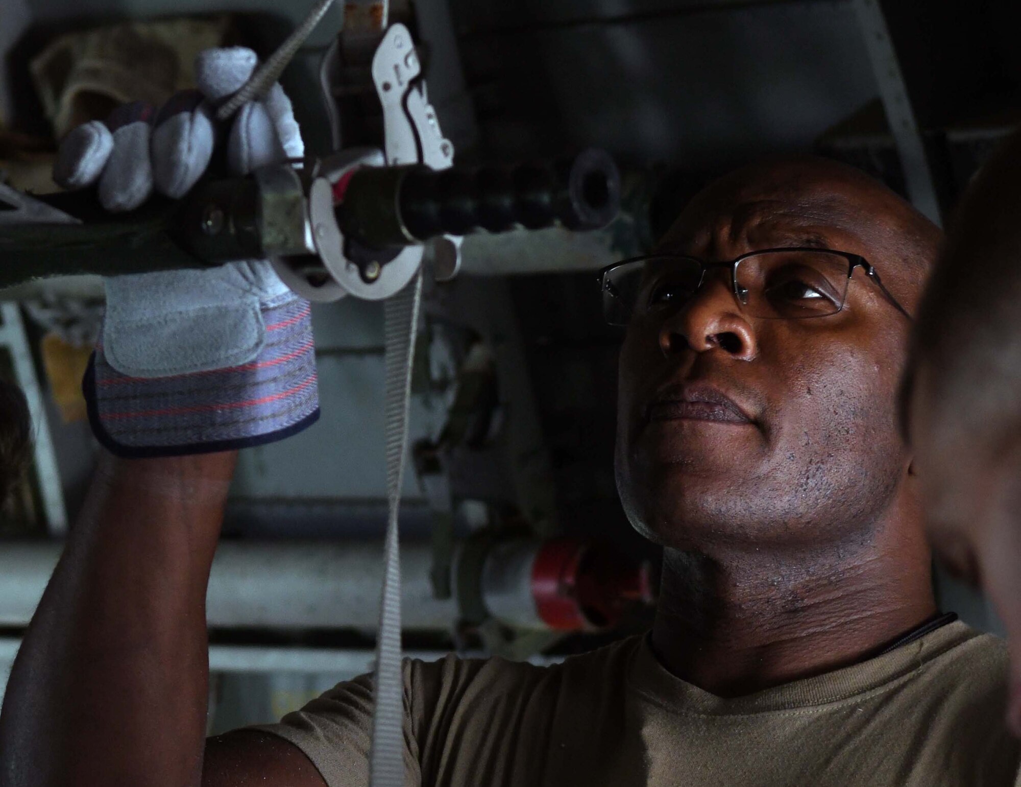 Master Sgt. Stewart Smith, 433rd Aeromedical Staging Squadron first sergeant, secures a litter inside a C-124 Globemaster II aircraft static display during a ground patient movement training exercise at Joint Base San Antonio-Lackland, Texas, August 7, 2022. The use of the static display allowed participants to practice procedures similar to loading and offloading a C-130 Hercules aircraft during a medevac mission. (U.S. Air Force photo by Tech. Sgt. Mike Lahrman)