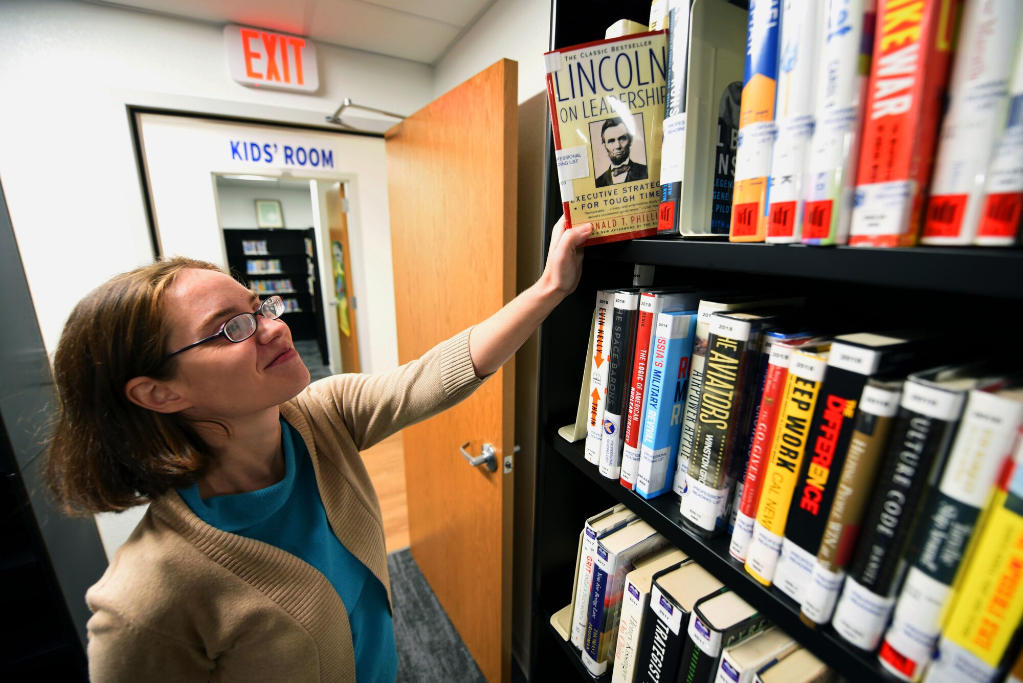 Librarian puts books away