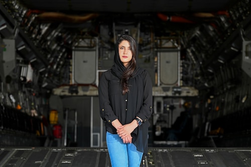 Zarafshan “Zaro” Mirzaie, an Afghan evacuee, revisits the same C-17 Globemaster III that carried her to the U.S., reflecting on the one-year anniversary of Operation Allies Refuge at Dover Air Force Base, Del., Aug. 8, 2022. Zaro flew out of Afghanistan in August 2021 and was the 2,311th Afghan to arrive at Task Force Liberty on Joint Base McGuire-Dix-Lakehurst, N.J., during Operation Allies Welcome. (U.S. Air Force photo by Senior Airman Stephani Barge)