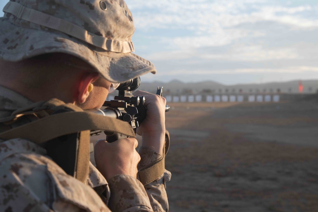 A U.S. Marine Corps recruit with Golf Company, 2nd Recruit Training Battalion, shoots a table one course of fire at Marine Corps Base Camp Pendleton, California, Aug. 9, 2022. The table one course of fire covers the basic fundamentals of marksmanship and rifle safety. (Marine Corps photo by Lance Cpl.  Hutchinson)