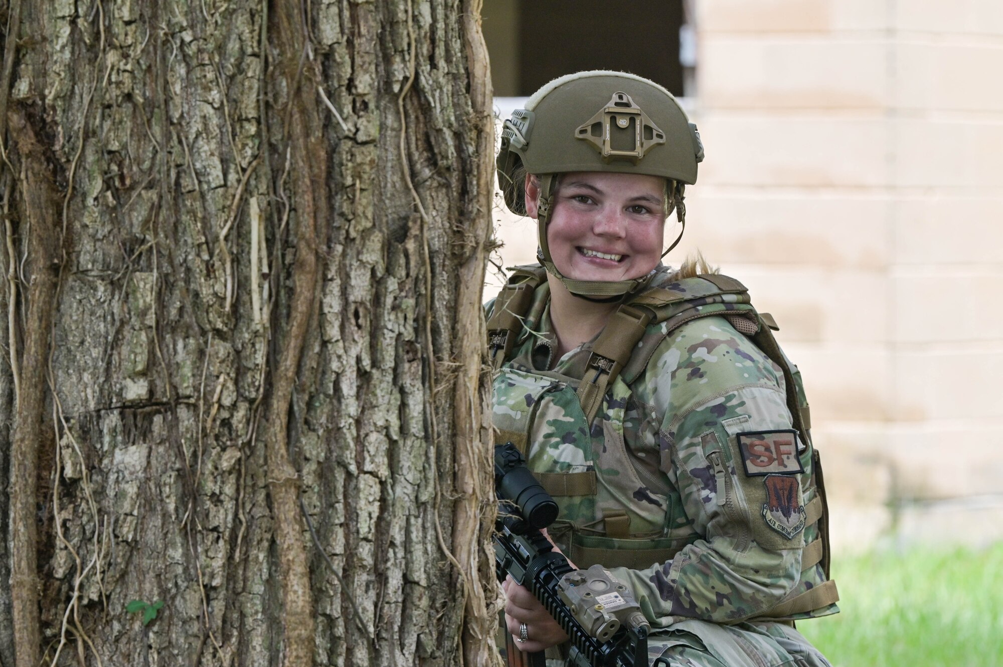 Photo of an Airman crouching