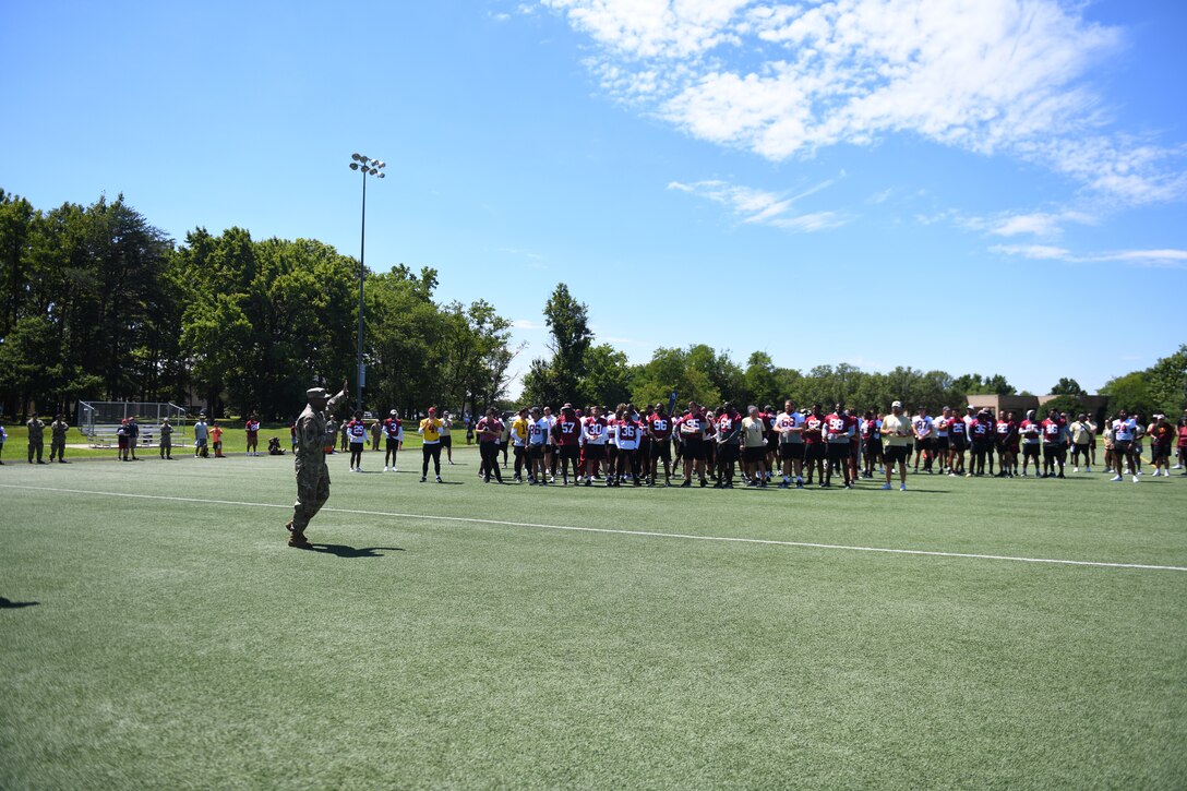 Col. Todd Randolph, 316th Wing and installation commander, speaks at the Washington Commanders football team pre-season practice demonstration at Joint Base Andrews, Md., Aug. 12, 2022.