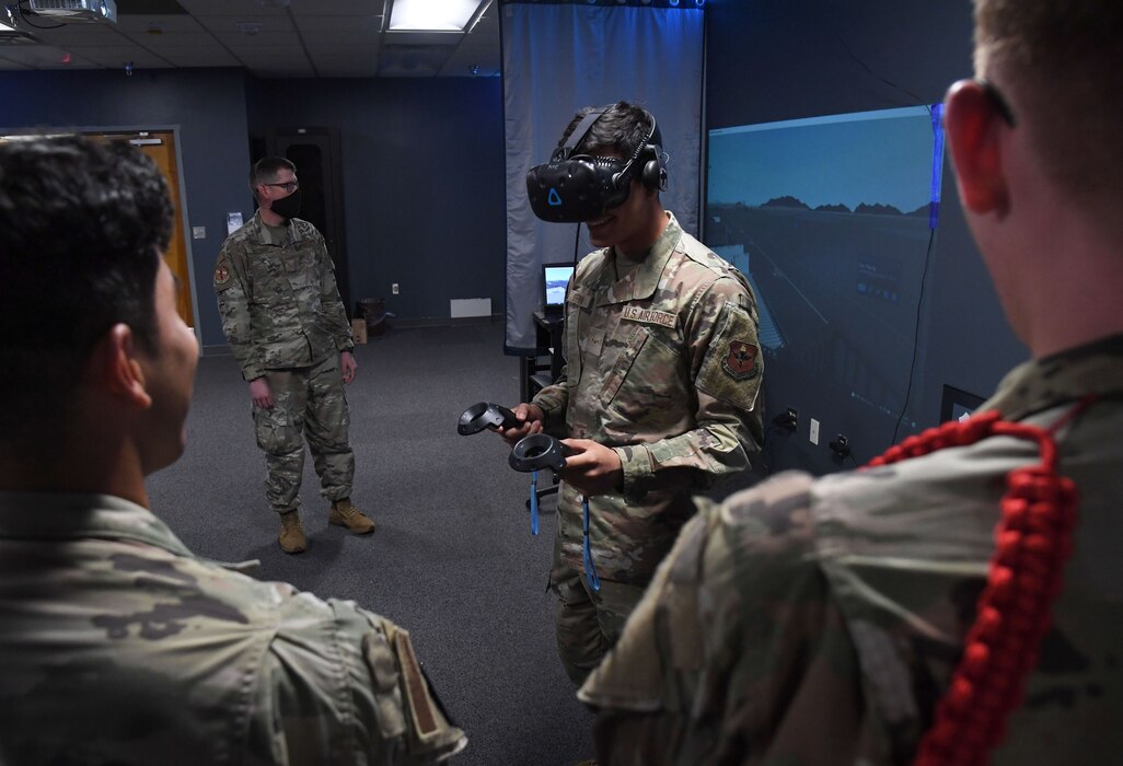 U.S. Air Force Airman Gabriel Hoffman, 335th Training Squadron student, participates in a virtual reality training session during the weather initial skills course inside of the Joint Weather Training Facility at Keesler Air Force Base, Mississippi, July 21, 2022. The weather apprentice course, which graduated 650 students this past year, takes 151 academic days to complete. Approximately 7,400 students go through the 335th TRS's 13 Air Force Specialty Codes each year. (U.S. Air Force photo by Kemberly Groue)