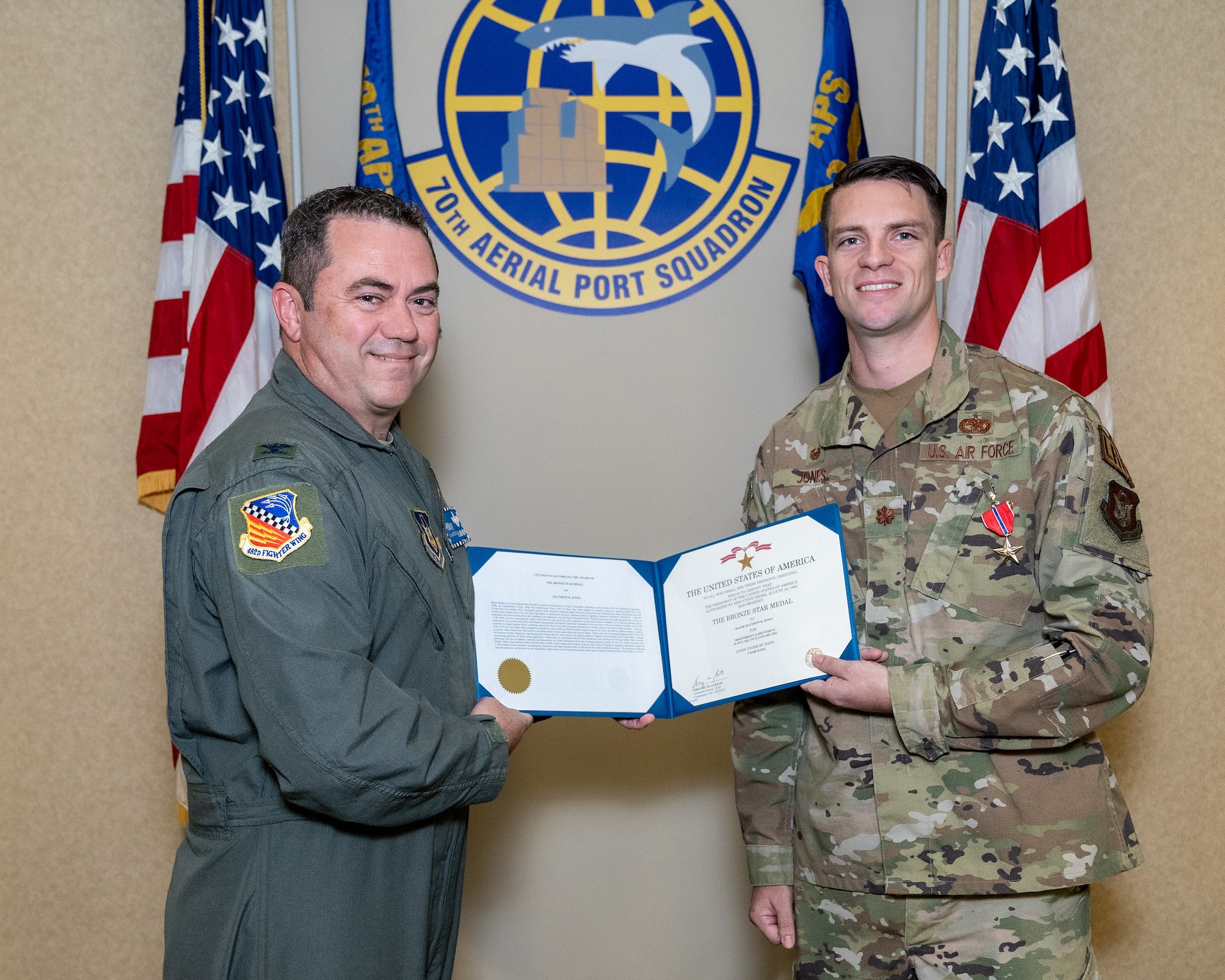 Maj. Matthew R. Jones, 70th Aerial Port Squadron Commander, was awarded the Bronze Star Medal by Col. S. James Frickel, 482nd Fighter Wing Vice Commander, for meritorious achievement at Homestead Air Reserve Base, Florida, August 6, 2022. The Bronze Star Medal, awarded to military members since 1944, is the fourth highest achievable medal. (U.S. Air Force photo by Tech. Sgt. Lionel Castellano)