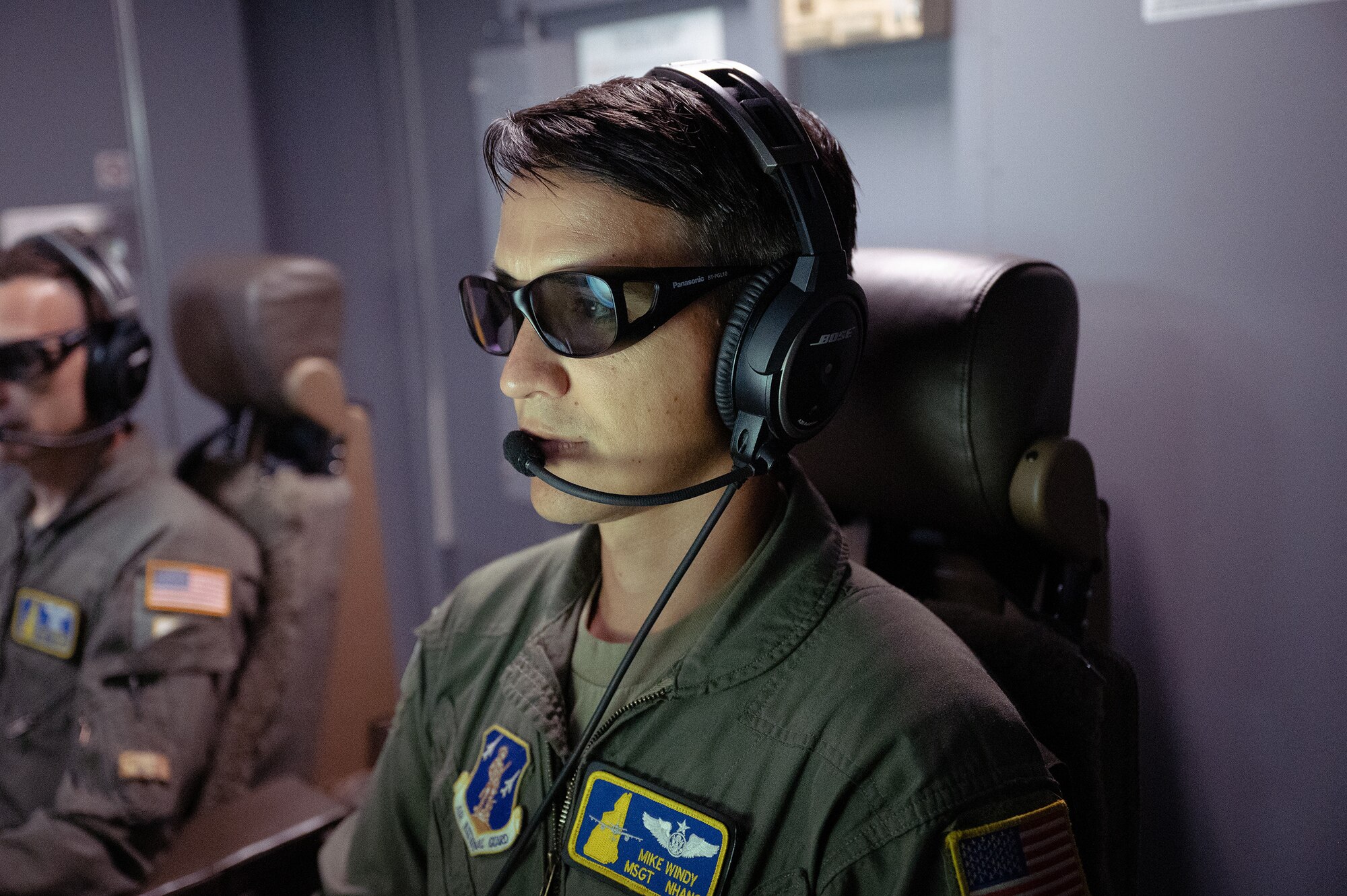 (from left to right) Tech Sgt. Matt Rogers and Master Sgt. Mike Windy, boom operators with the 157th Air Refueling Wing, conduct an aerial fueling on a KC-46 Pegasus in the sky off the coast of New England, Aug. 3, 2022.