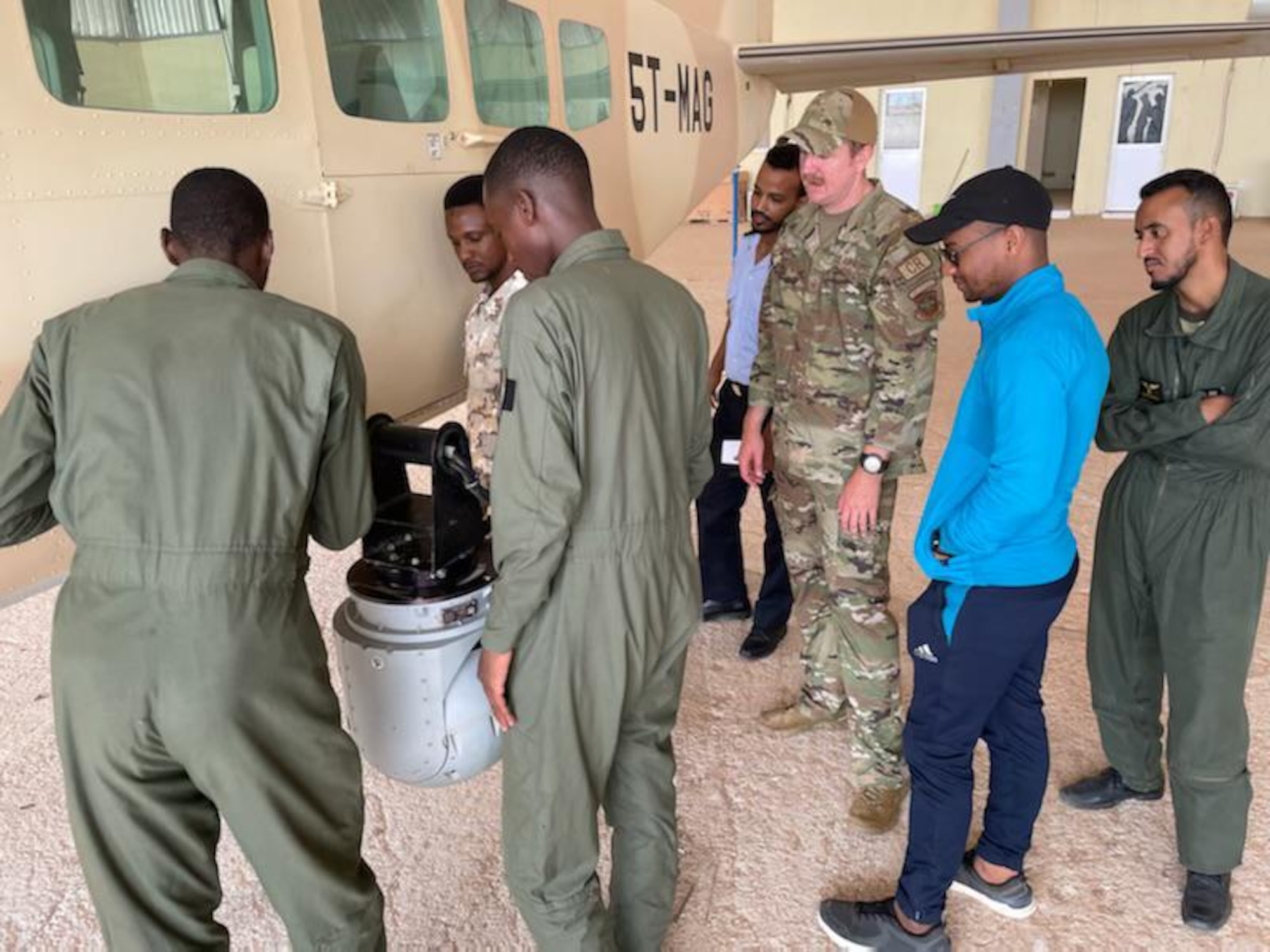 Mauritanian Air Force students conduct hands-on intelligence, surveillance, and reconnaissance system training July 28, 2022, Nouakchott, Mauritania. Air advisors provided aircraft wiring fundamentals and aircrew ground training in support of the Mauritanian Air Force's AC-208 Combat Caravan program.