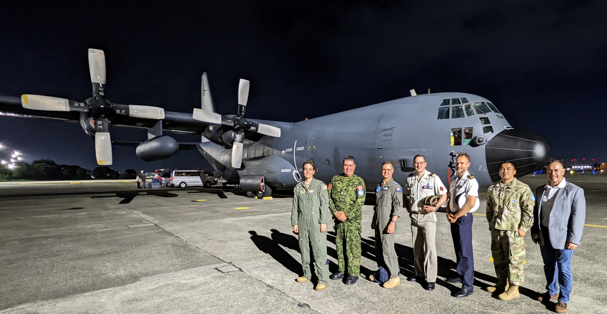 United Nations Command – Rear and 374th Airlift Wing leadership take a photo outside of a C-130H Hercules assigned to the French Air Force (Armee de L'air) at Yokota Air Base, Japan, Aug. 10, 2022. The French Air Force and separately the Royal Thai Air Force 601 Squadron came to Japan during the same period to perform their own multilateral trainings. Both France and Thailand are part of the United Nation and Yokota Air Base is one of seven U.S. bases designated for joint United Nations Command - Rear use. (U.S. Air Force photo by Tech. Sgt. Garrett Cole)