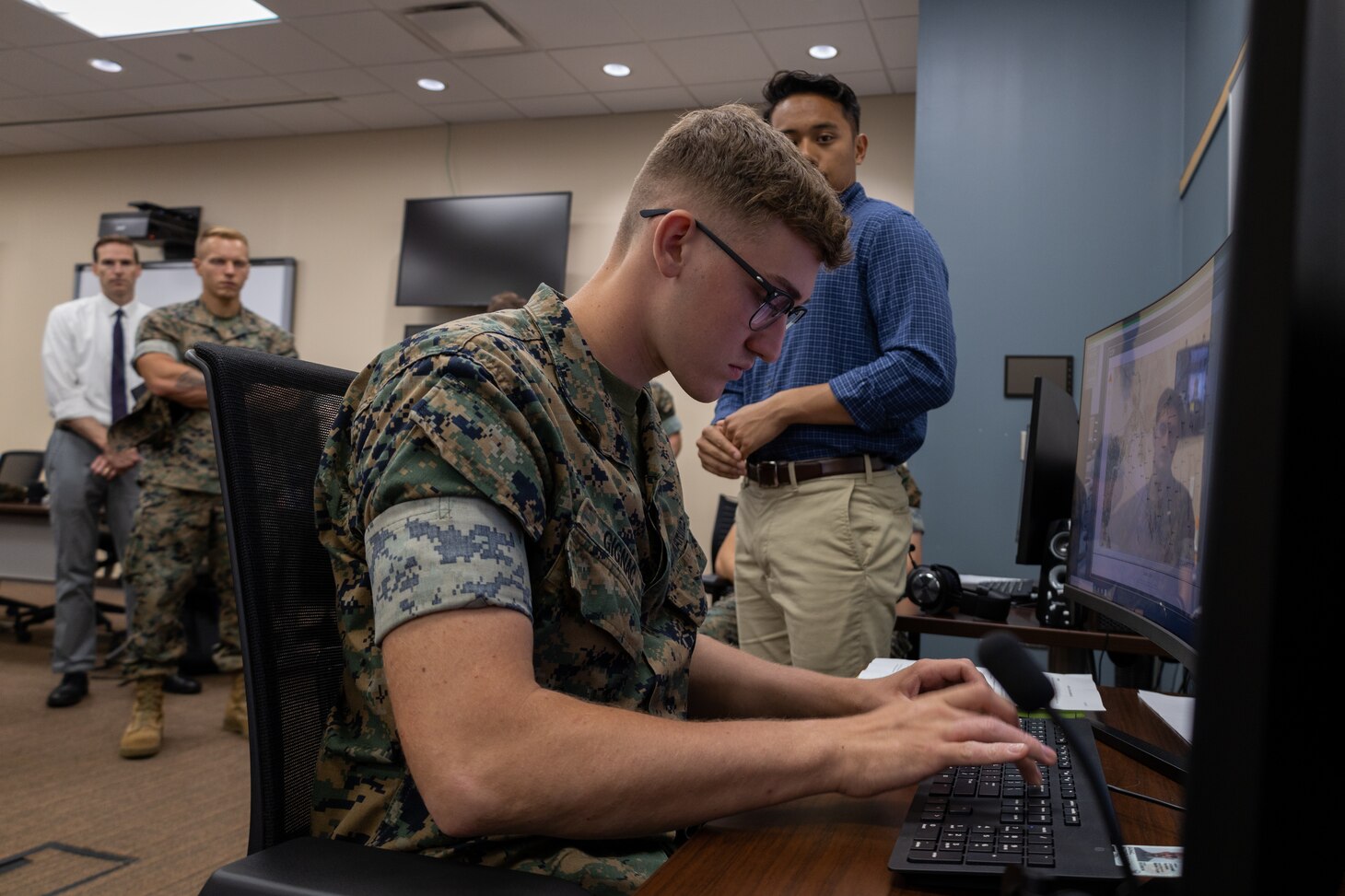 U.S. Marine Corps Lance Cpl. Matthew R. Gignac, an air-support operations operator with Marine Air Support Squadron  1, operates a prototype of the Gaming Environment for Air Readiness at Marine Corps Air Station Cherry Point, North Carolina, July 28, 2022. The GEAR is an artificial-intelligence enabled and role-based simulation designed to train and develop MASS-1 Marines by exposing them to interactive scenarios prior to participating in an exercise or deployment. MASS-1 is a subordinate unit of 2nd Marine Aircraft Wing, the aviation combat element of II Marine Expeditionary Force.