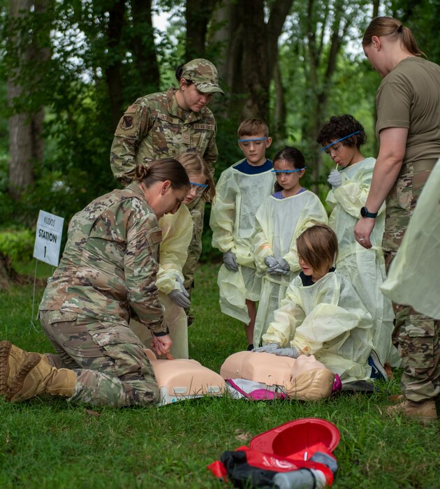 Children take part in a CPR exercise led by 88th Medical Group Airmen.
