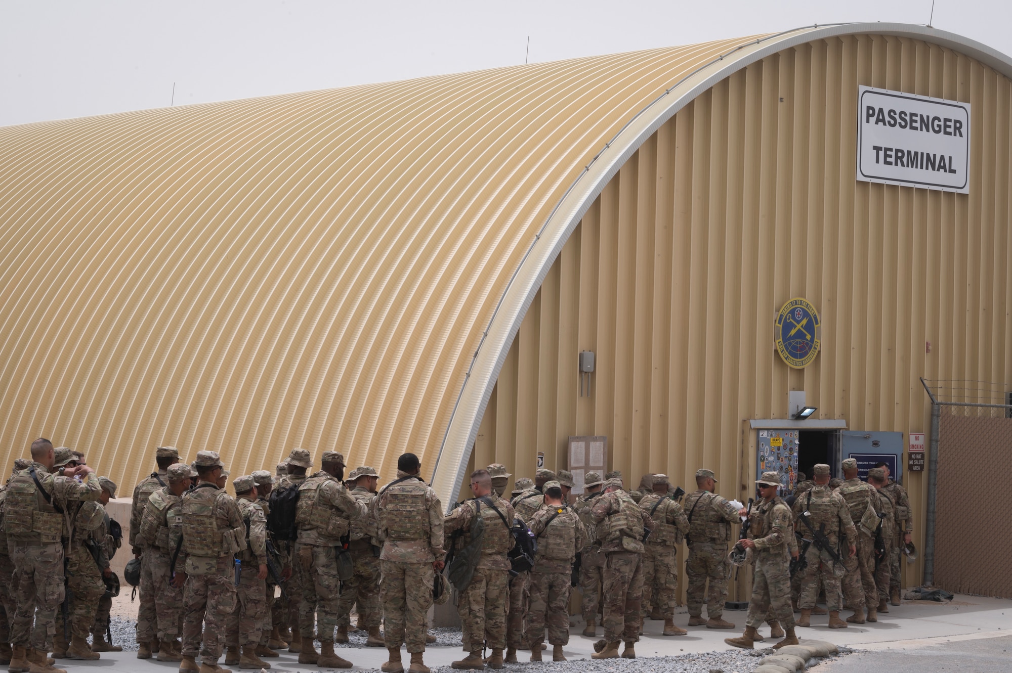 U.S. Army Task Force Griz Soldiers from the 1st Combined Arms Battalion, 163rd Cavalry Regiment, arrive to inprocess through the 386th Expeditionary Logistics Readiness Squadron passenger terminal during an Emergency Deployment Rapid Exercise at Ali Al Salem Air Base, Kuwait, August 10, 2022. The EDRE tested how fast Soldiers could report to the PAX terminal and how quickly Airmen from the 386th ELRS were able to process a mass movement of military personnel through their terminal and onto an aircraft at a moment’s notice. (U.S. Air Force photo by Staff Sgt. Dalton Williams)