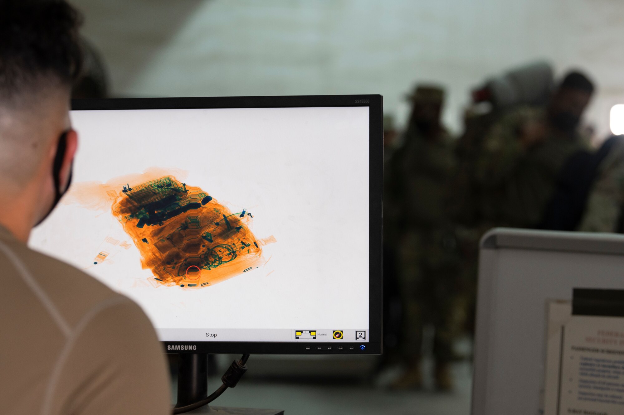 U.S. Air Force Senior Airman Immanuel Zion Reyes, 386th Expeditionary Logistics Readiness Squadron passenger service representative, operates an x-ray machine to scan luggage during an Emergency Deployment Rapid Exercise at the 386th ELRS passenger terminal at Ali Al Salem Air Base, Kuwait, August 10, 2022. Part of the new 386th ELRS passenger team rotation, this exercise demonstrated to the team that no matter the size of the mission they are able to operate at a high rate of speed with the same efficiency. (U.S. Air Force photo by Staff Sgt. Dalton Williams)