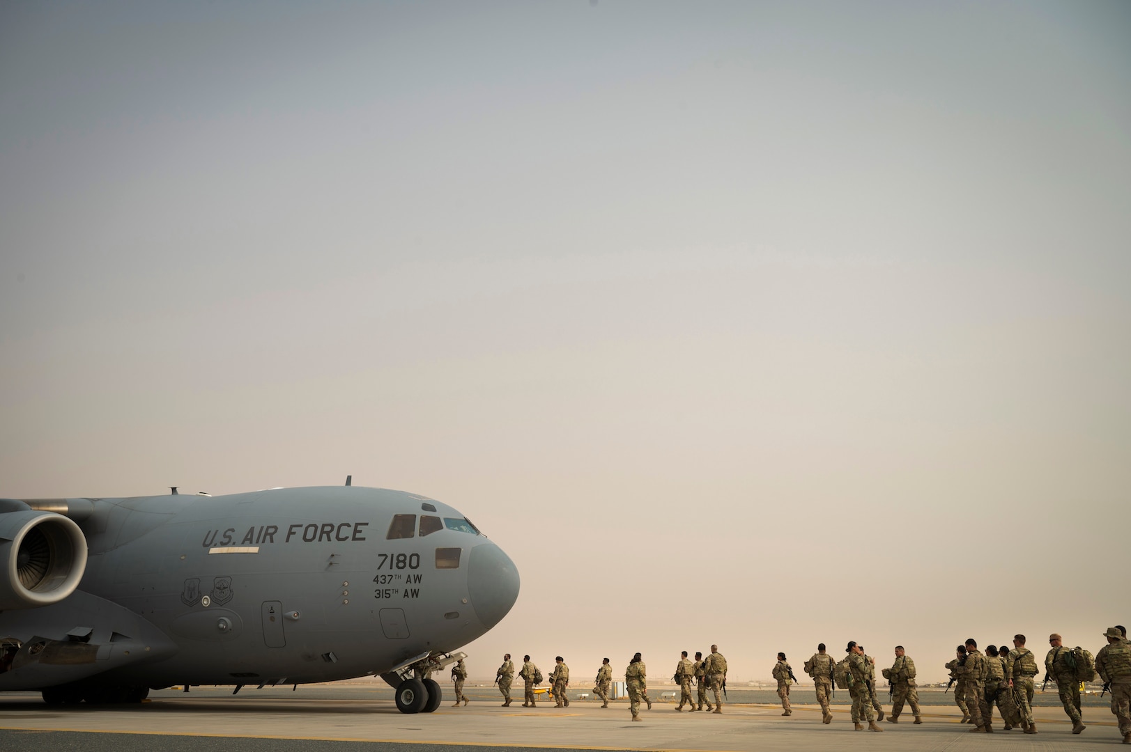 U.S. Army Task Force Griz Soldiers from the 1st Combined Arms Battalion, 163rd Cavalry Regiment, board a C-17 Globemaster III during an Emergency Deployment Rapid Exercise at Ali Al Salem Air Base, Kuwait, August 10, 2022. This exercise tested the ability for more than 120 Soldiers to report to Ali Al Salem Air Base within a short notice, and for Airmen to be able to quickly process the Soldiers and rapidly transport them to the needed location with little notice. “It made me proud to be here and feel like I’m making a difference,” said Airman 1st Class Robert Berry, 386th ELRS passenger service representative. “It’s nice to know that my part matters.” (U.S. Air Force photo by Staff Sgt. Dalton Williams)