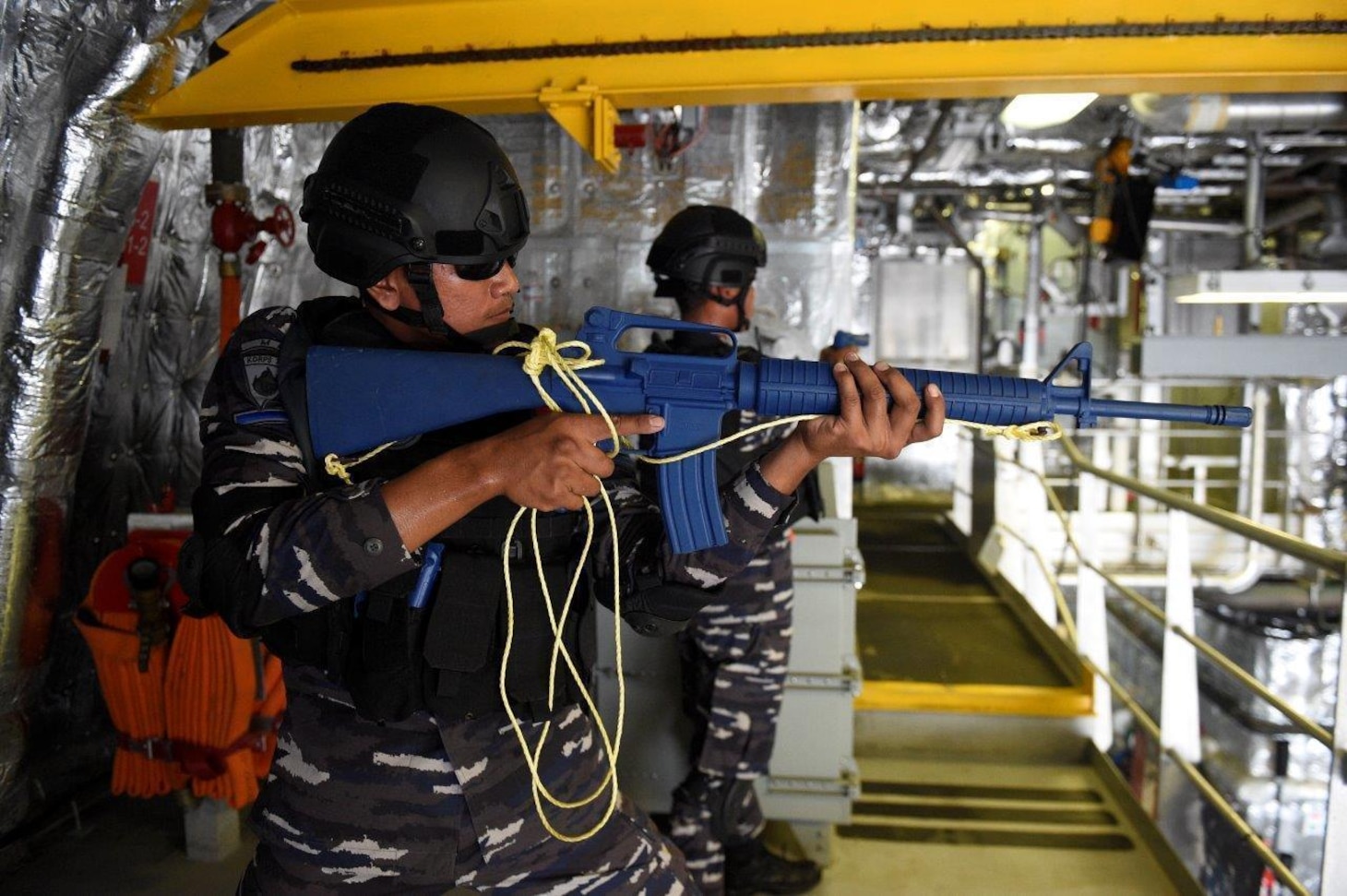 Tentera Nasional Indonesia - Angkatan Laut (TNI-AL) sailors assigned to the Bung Tomo-class corvette KRI Bung Tomo (357) participate in a visit, board, search, and seizure (VBSS) exercise aboard the Independence-variant littoral combat ship USS Charleston (LCS 18) during Super Garuda Shield in the Natuna Sea Aug. 4, 2022. Charleston, part of Destroyer Squadron (DESRON) 7, is on a rotational deployment, operating in the U.S. 7th Fleet area of operations to enhance interoperability with partners and serve as a ready-response force in support of a free and open Indo-Pacific region. Garuda Shield is an annual combined and joint exercise between the Indonesian National Armed Forces and U.S. Indo-Pacific Command (INDOPACOM) designed to strengthen bilateral interoperability, capabilities, trust, and cooperation built over decades of shared experiences.