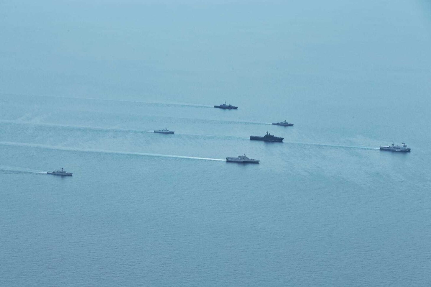 Tentera Nasional Indonesia - Angkatan Laut (TNI-AL), Republic of Singapore Navy, and U.S. Navy ships sail in formation during exercise Super Garuda Shield in the Natuna Sea Aug. 3, 2022. Garuda Shield is an annual combined and joint exercise between the Indonesian National Armed Forces and U.S. Indo-Pacific Command (INDOPACOM) designed to strengthen bilateral interoperability, capabilities, trust, and cooperation built over decades of shared experiences.