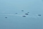 Tentera Nasional Indonesia - Angkatan Laut (TNI-AL), Republic of Singapore Navy, and U.S. Navy ships sail in formation during exercise Super Garuda Shield in the Natuna Sea Aug. 3, 2022. Garuda Shield is an annual combined and joint exercise between the Indonesian National Armed Forces and U.S. Indo-Pacific Command (INDOPACOM) designed to strengthen bilateral interoperability, capabilities, trust, and cooperation built over decades of shared experiences.