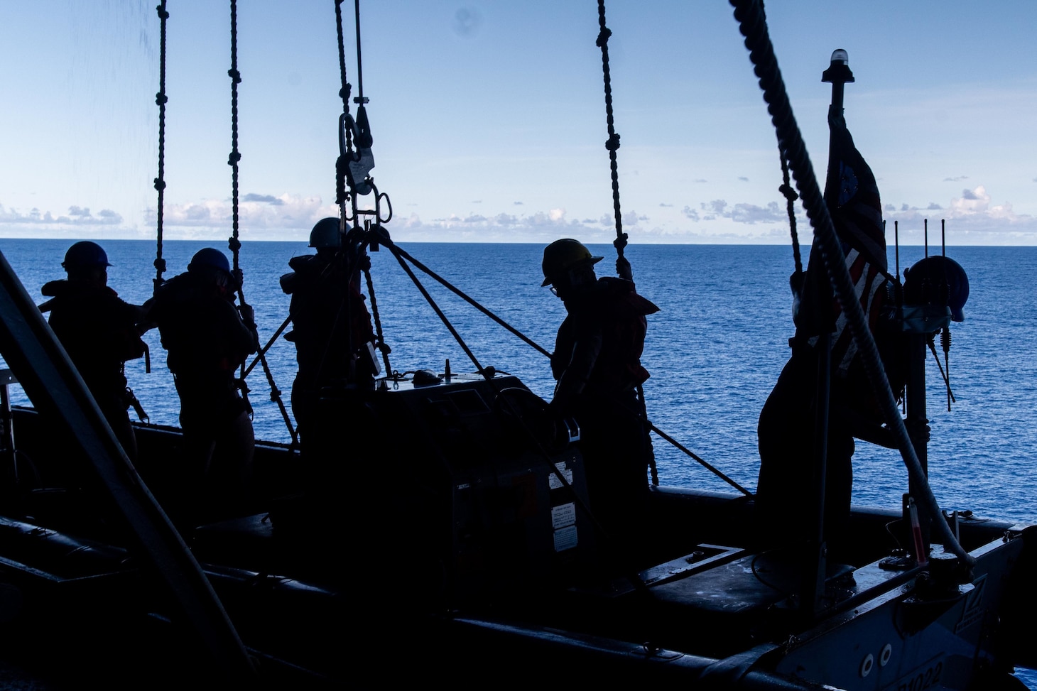 PHILIPPINE SEA (Aug 13, 2022) Sailors assigned to the U.S. Navy’s only forward-deployed aircraft carrier USS Ronald Reagan (CVN 76) prepare to lower a rigid-hull inflatable boat into the sea during small boat operations in the Philippine Sea, Aug. 13. Ronald Reagan’s rigid-hull inflatable boats are able to perform tasks including at sea rescue operations. Ronald Reagan, the flagship of Carrier Strike Group 5, provides a combat-ready force that protects and defends the United States, and supports alliances, partnerships and collective maritime interests in the Indo-Pacific region. (U.S. Navy photo by Mass Communication Specialist 2nd Class Keyly Santizo)