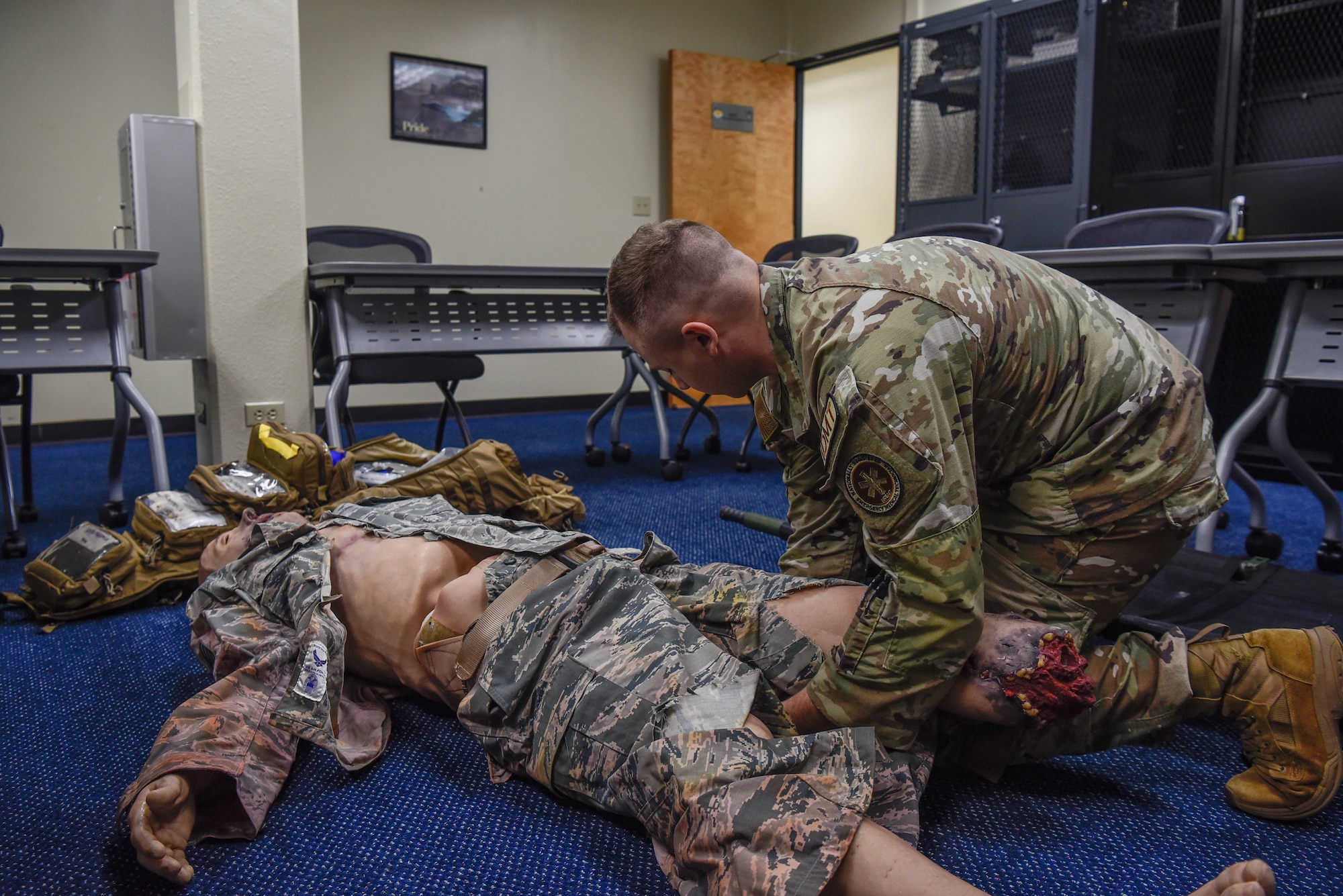 U.S. Air Force Staff Sgt. Finn Tipps, an independent duty medical technician assigned to the 36th Contingency Response Support Squadron, practices troop combat casualty care on a training mannequin on August 8, 2022, at Andersen Air Force Base, Guam. The skills Tipps has learned from the Air Force, allowed him to know how to provide care to a civilian in an off-base incident. (U.S. Air Force Photo by Airman 1st Class Allison Martin)