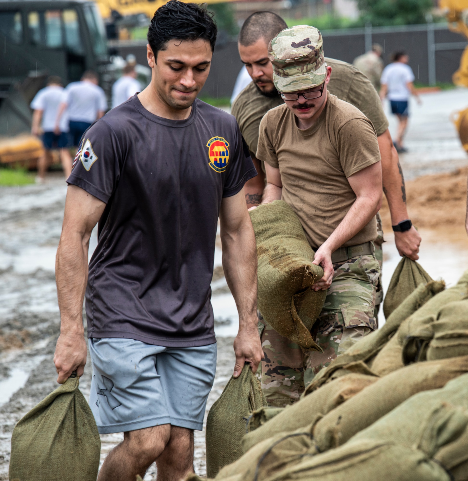Airmen assigned to the 51st Fighter Wing fill sandbags at Osan Air Base, Republic of Korea, Aug. 9, 2022.