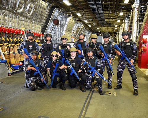 Sailors from the amphibious transport dock USS Green Bay (LPD 20) and Bung Tomo-class corvette KRI Bung Tomo (357) pose for a photo during a visit, board, search, and seizure (VBSS) exercise aboard the Independence-variant littoral combat ship USS Charleston (LCS 18) as a part of Super Garuda Shield in the Natuna Sea Aug. 4, 2022. Green Bay, part of Amphibious Squadron 11, is operating in the U.S. 7th Fleet area of responsibility to enhance interoperability with allies and partners and serve as a ready response force to defend peace and stability in the Indo-Pacific region. Charleston, part of Destroyer Squadron (DESRON) 7, is on a rotational deployment, operating in the U.S. 7th Fleet area of operations to enhance interoperability with partners and serve as a ready-response force in support of a free and open Indo-Pacific region. Garuda Shield is an annual combined and joint exercise between the Indonesian National Armed Forces and U.S. Indo-Pacific Command (INDOPACOM) designed to strengthen bilateral interoperability, capabilities, trust, and cooperation built over decades of shared experiences.