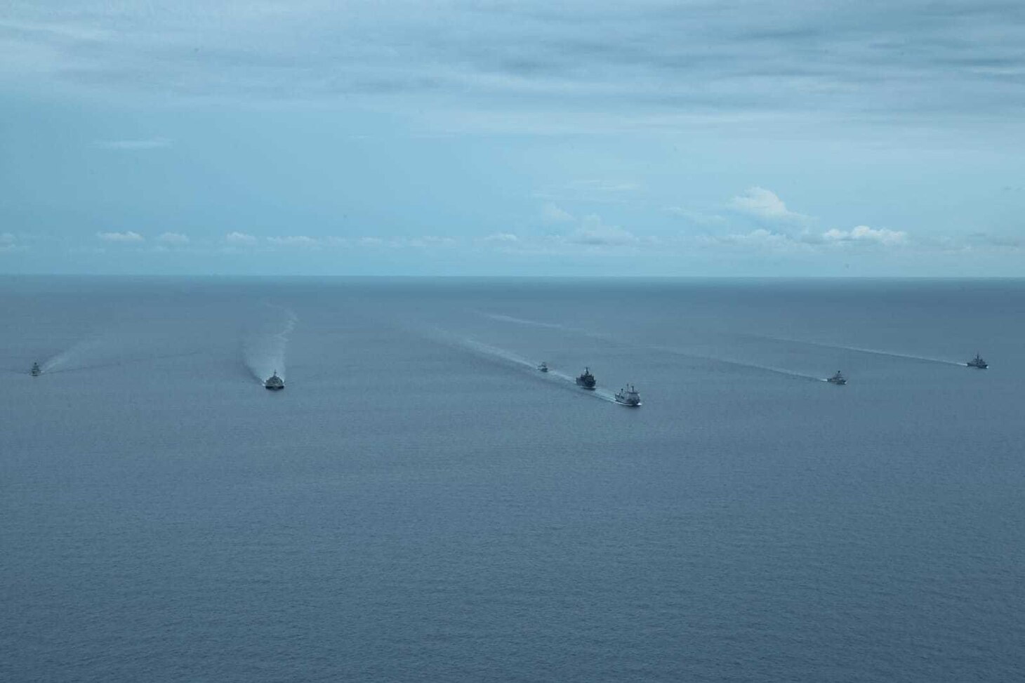 Tentera Nasional Indonesia - Angkatan Laut (TNI-AL), Republic of Singapore Navy, and U.S. Navy ships sail in formation during exercise Super Garuda Shield in the Natuna Sea Aug. 3, 2022. Garuda Shield is an annual combined and joint exercise between the Indonesian National Armed Forces and U.S. Indo-Pacific Command (INDOPACOM) designed to strengthen bilateral interoperability, capabilities, trust, and cooperation built over decades of shared experiences.