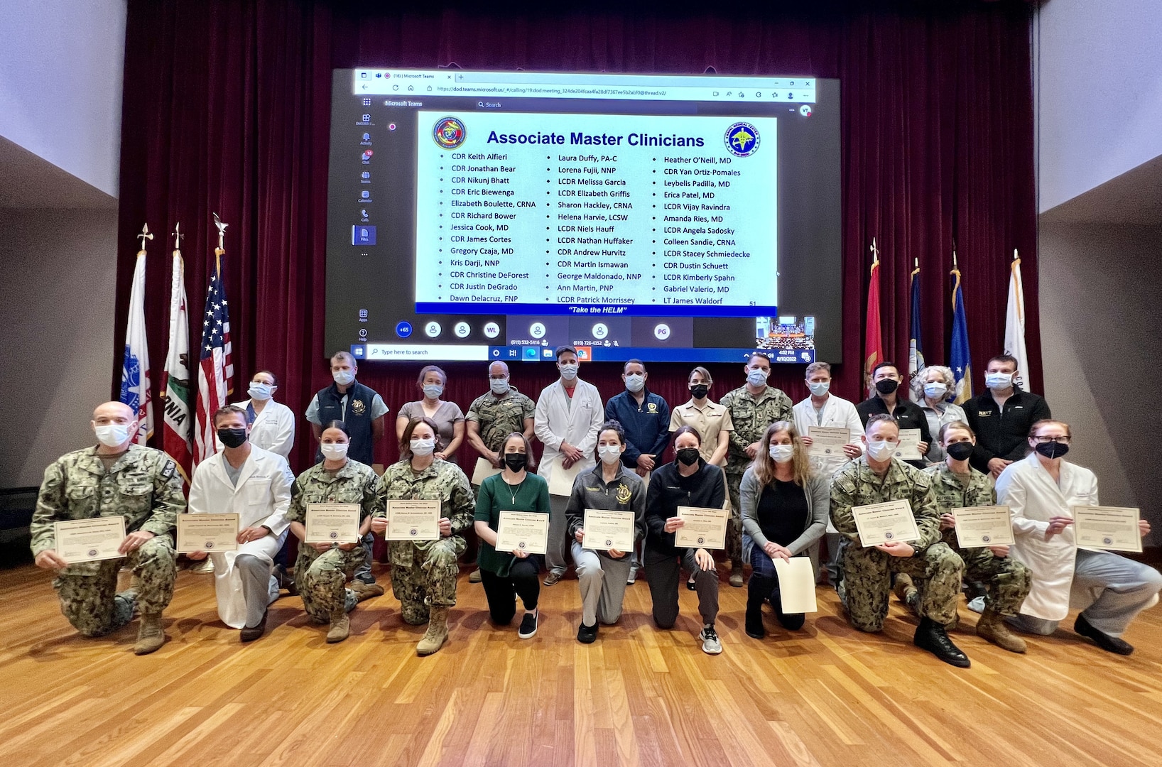 Junior clinicians who are honored as Associate Master Clinicians during a ceremony at Naval Medical Center San Diego's (NMCSD) auditorium gather for a group photo on Aug. 10. During the ceremony, 24 senior clinicians received the Master Clinician Award and 39 other clinicians were recognized as Associate Ma