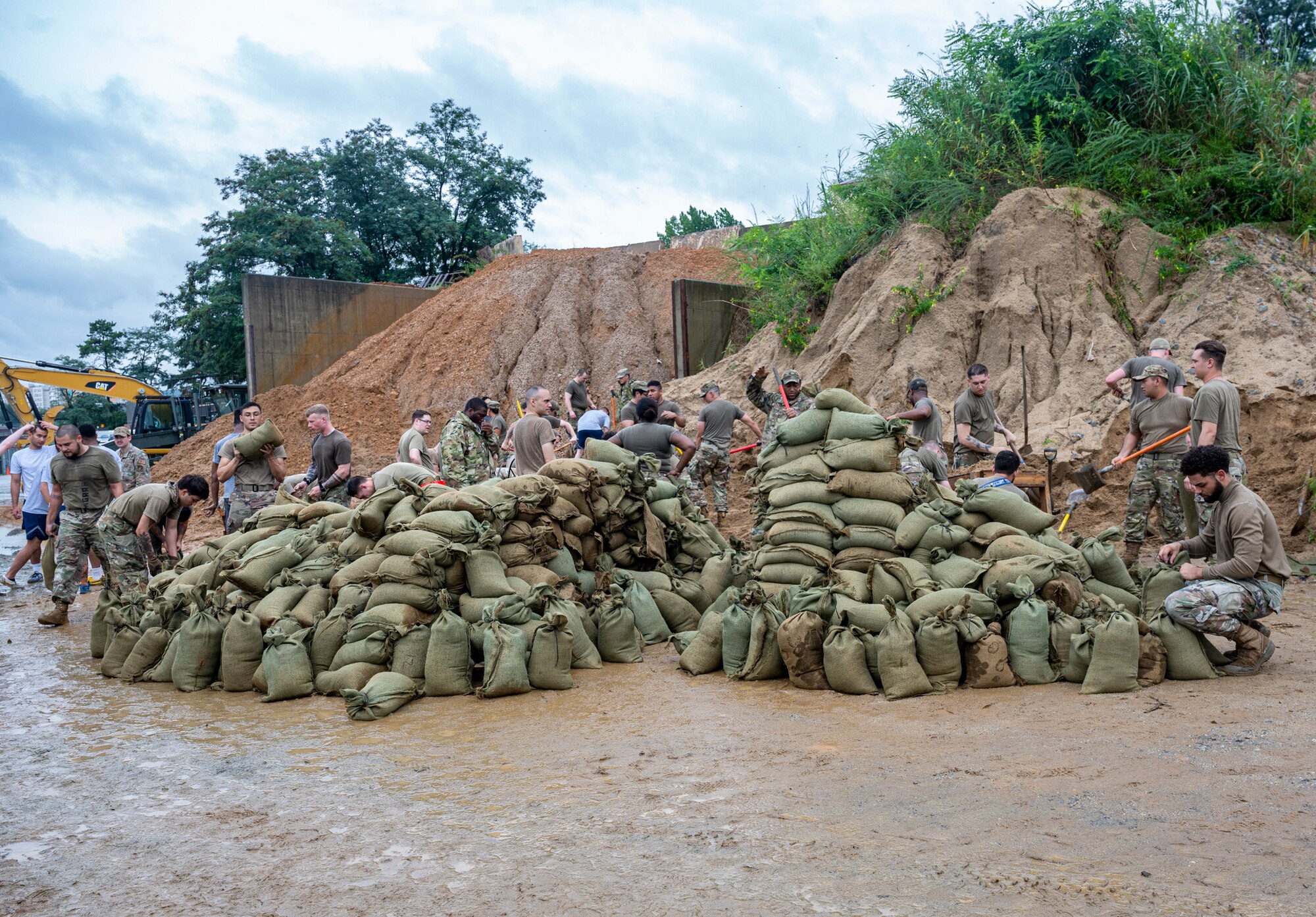 Airmen assigned to the 51st Fighter Wing fill sandbags at Osan Air Base, Republic of Korea, Aug. 9, 2022.