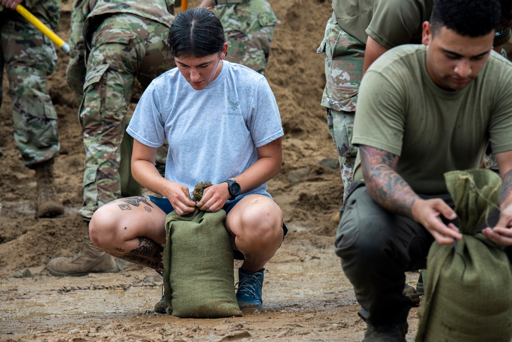 Airmen assigned to the 51st Fighter Wing fill sandbags at Osan Air Base, Republic of Korea, Aug. 9, 2022