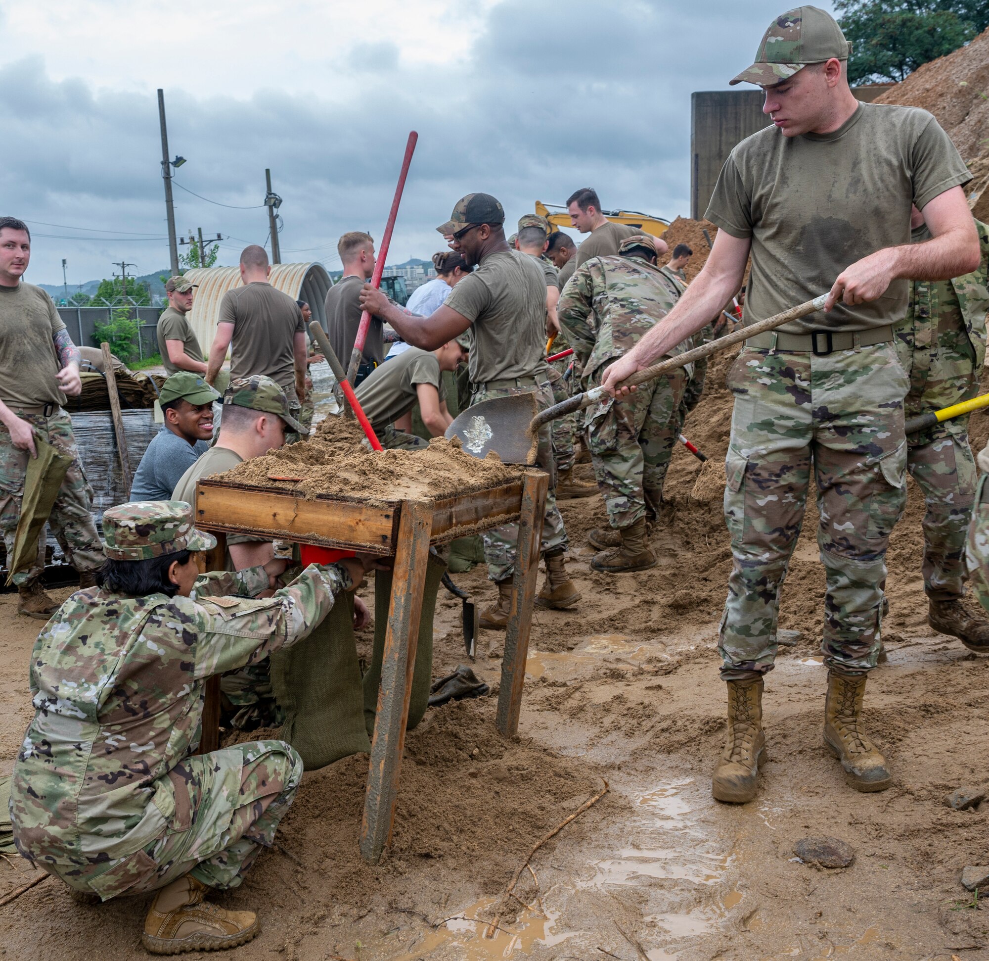 Airmen assigned to the 51st Fighter Wing fill sandbags at Osan Air Base, Republic of Korea, Aug. 9, 2022.