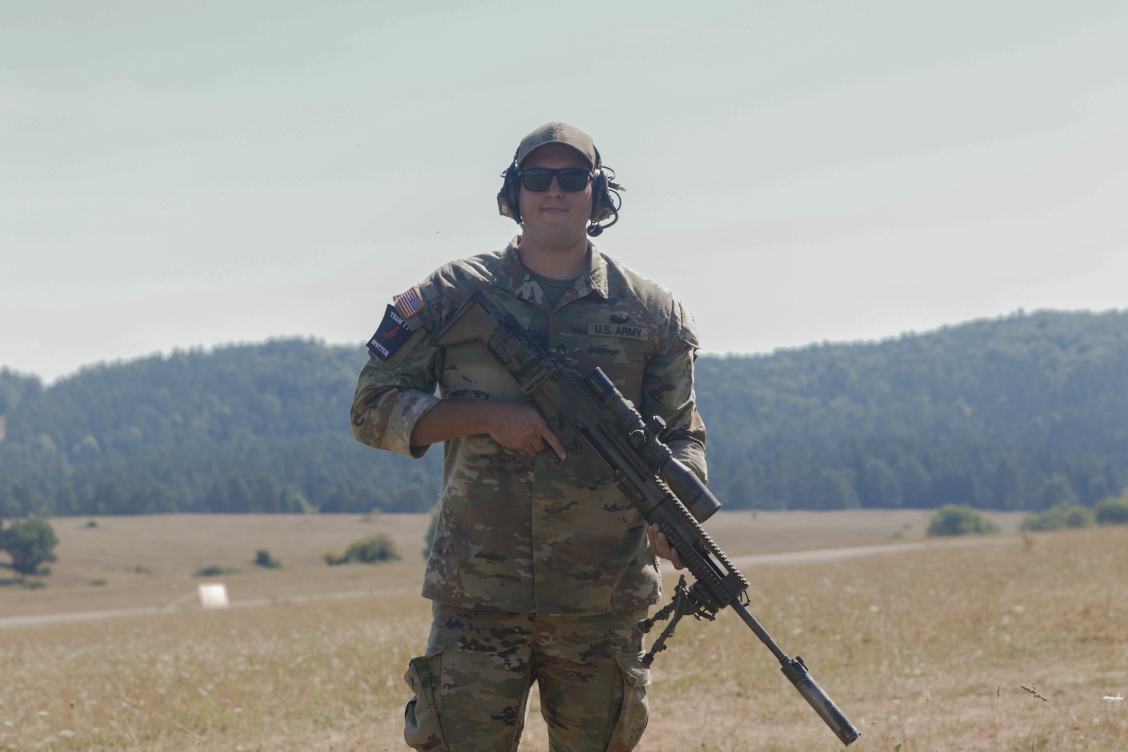 U.S. Army Sgt. Dalton Weist, a soldier assigned to 1st Battalion, 109th Infantry Regiment, poses for a photo during the European Best Sniper Competition at Hohenfels Training Area, Germany, Aug. 5, 2022.