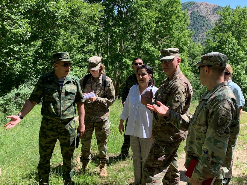 Maj. Gen. Jahondgir Nazaralizoda, acting commander, Republic of Tajikistan Mobile Forces, discusses the mission of the Romit-Magob Training Center with Maj. Gen. Wendul Hagler, Deputy Commanding General, U.S. Army Central, May 24, 2022.
