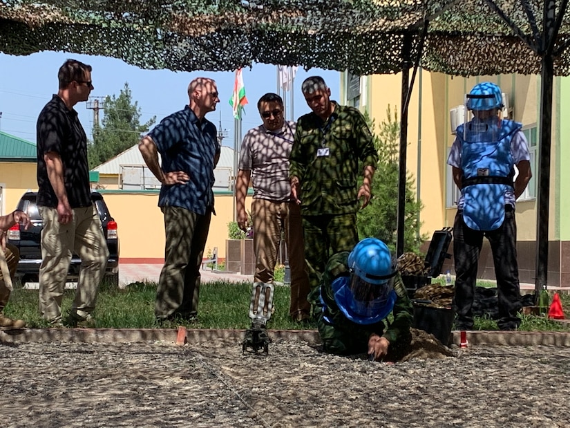 Maj. Gen. Wendul Hagler, Deputy Commanding General, U.S. Army Central, discusses humanitarian mine removal training with Col. Sulaimon Qodirzoda, head of Tajikistan's Regional Explosive Hazards Training Center, May 25, 2022