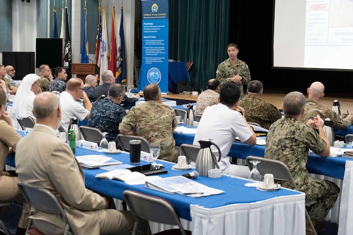 Vice Adm. Brad Cooper, commander of U.S. Naval Forces Central Command, U.S. 5th Fleet and Combined Maritime Forces, speaks during the Combined Force Maritime Component Commander (CFMCC) officer course in Manama, Bahrain, Aug. 14. The CFMCC course is a flag-level professional military education seminar designed to provide leadership tools to U.S. and partner-nation officers