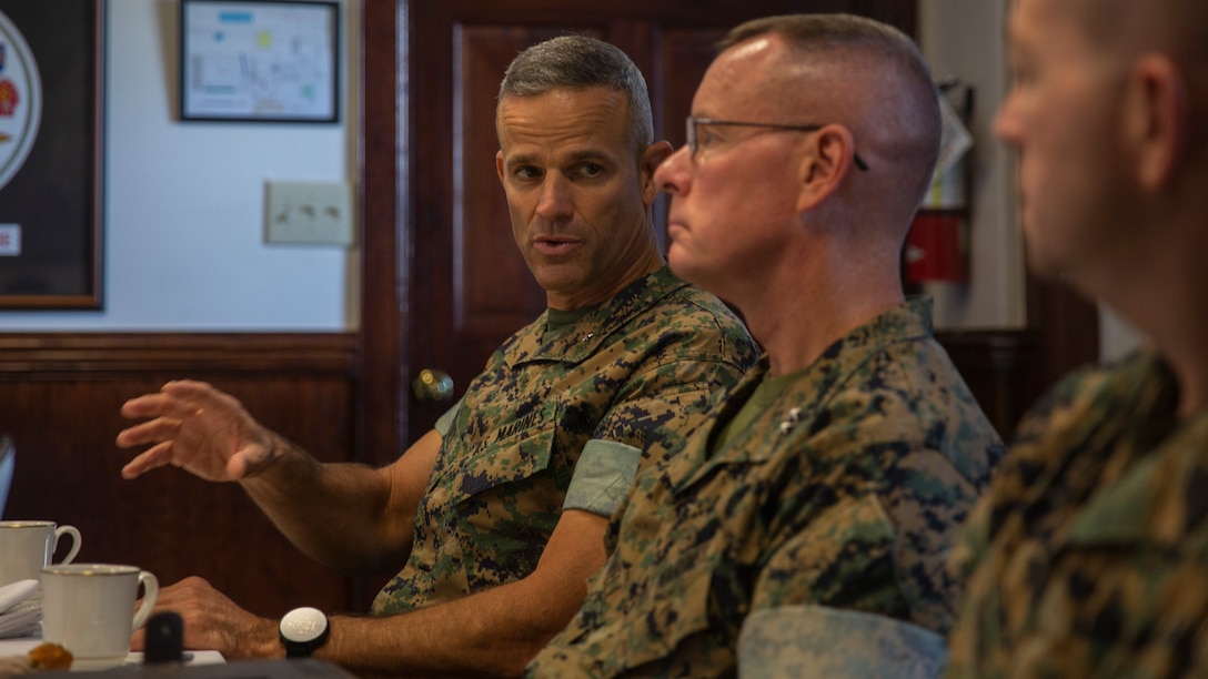 U.S. Marine Corps Brig. Gen. Andrew M. Niebel, left, commanding general, Marine Corps Installations East-Marine Corps Base (MCB) Camp Lejeune speaks with U.S. Marine Corps Maj. Gen. David W. Maxwell, middle, commander, Marine Corps Installations Command, Assistant Deputy Commandant, Installations and Logistics (Facilities), during a scheduled visit on MCB Camp Lejeune, North Carolina, Aug. 4, 2022.